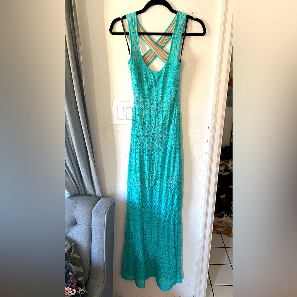 Bebe fitted cut out pattern maxi dress with crossing straps.
